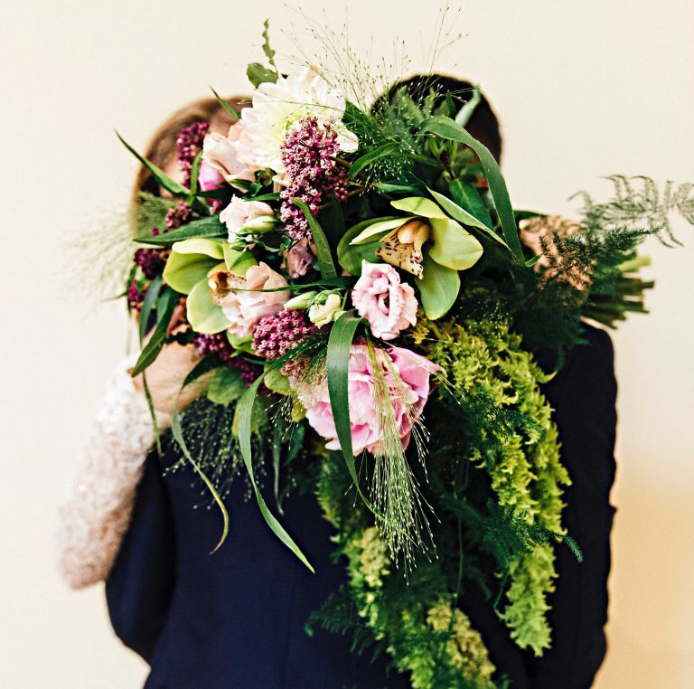 A couple with ferns flower bouquet style